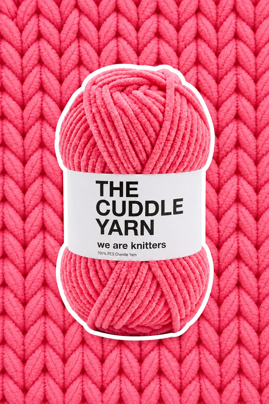 The Cuddle Yarn Pink skein on matching knit background